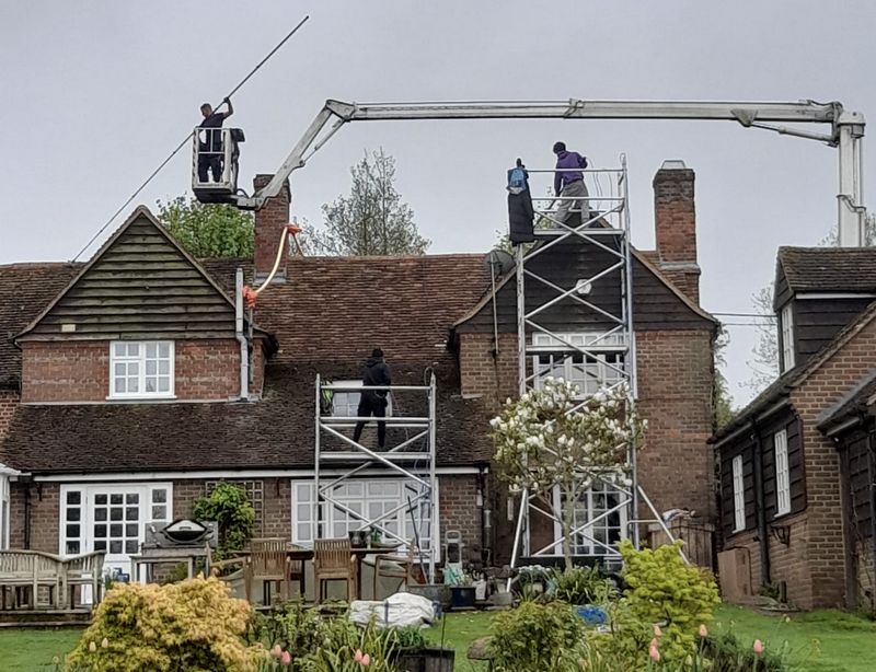 The Moss Cleaners using cherry picker and scaffolding to clean roof safely and professionally in 3 Merle Ave, Harefield, Uxbridge UB9 6DG, UK, 3 Merle Ave, Harefield, Uxbridge UB9 6DG, UK
